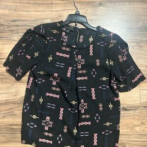 Metaphor Black Tee with Pink and Gold Geometric Patterns
